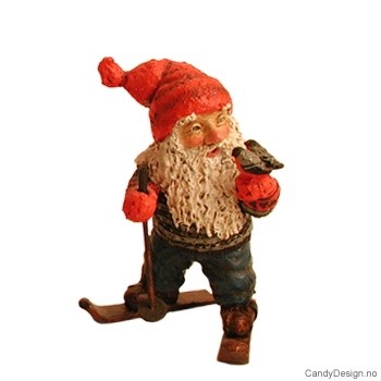 Gnome figurine with birds on skis