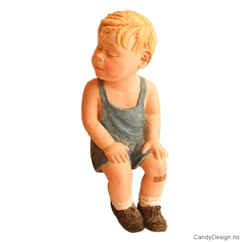 Sitting summerchildren  Boy sitting with his hands in his lap