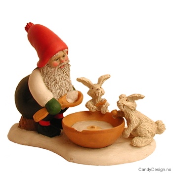 Julenisse med grøtskål og harer
