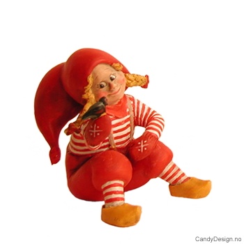Sitting christmas gnome girl in red and white