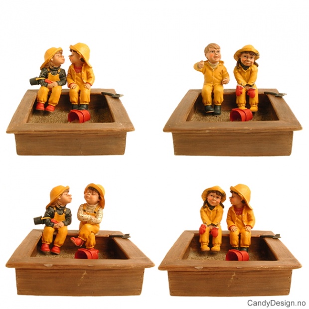 Two kindergarden children in sandbox assorted