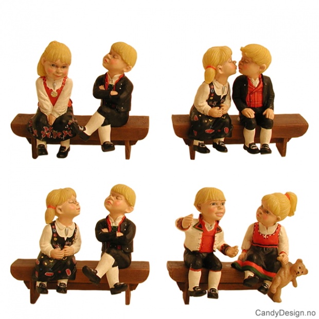 Children in national costume on bench souvenir assorted