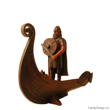 Viking warrior figurine standing in a vikingship with sword and shield